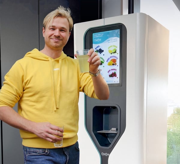 Man with water tap and drink